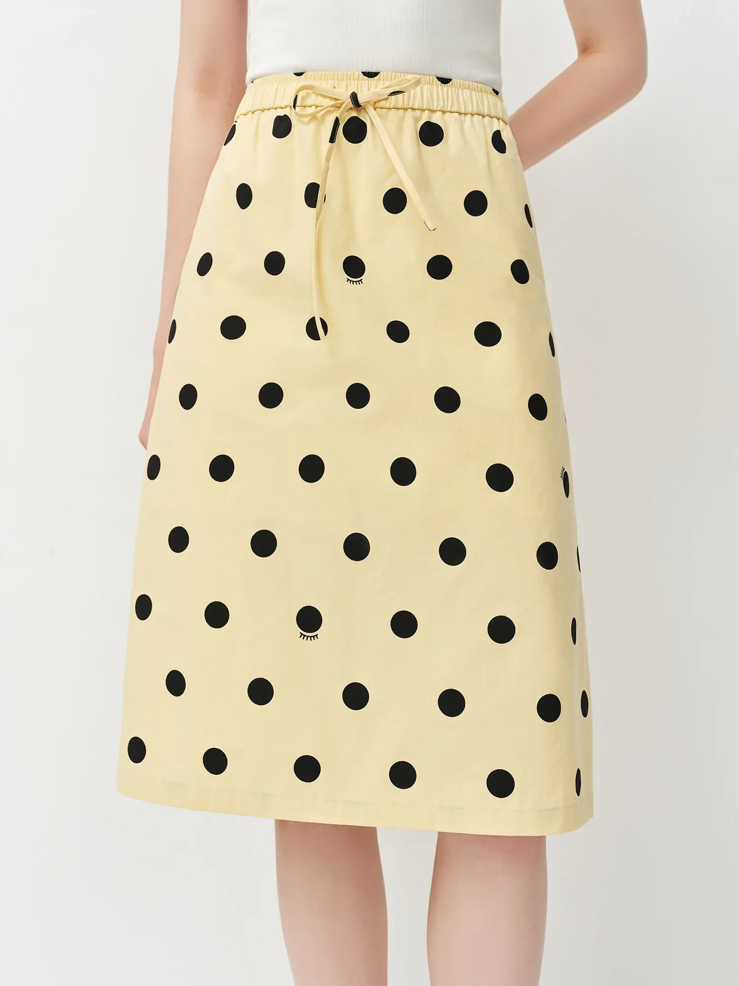 Jupe trapèze à pois en coton, taille empire et longueur genou