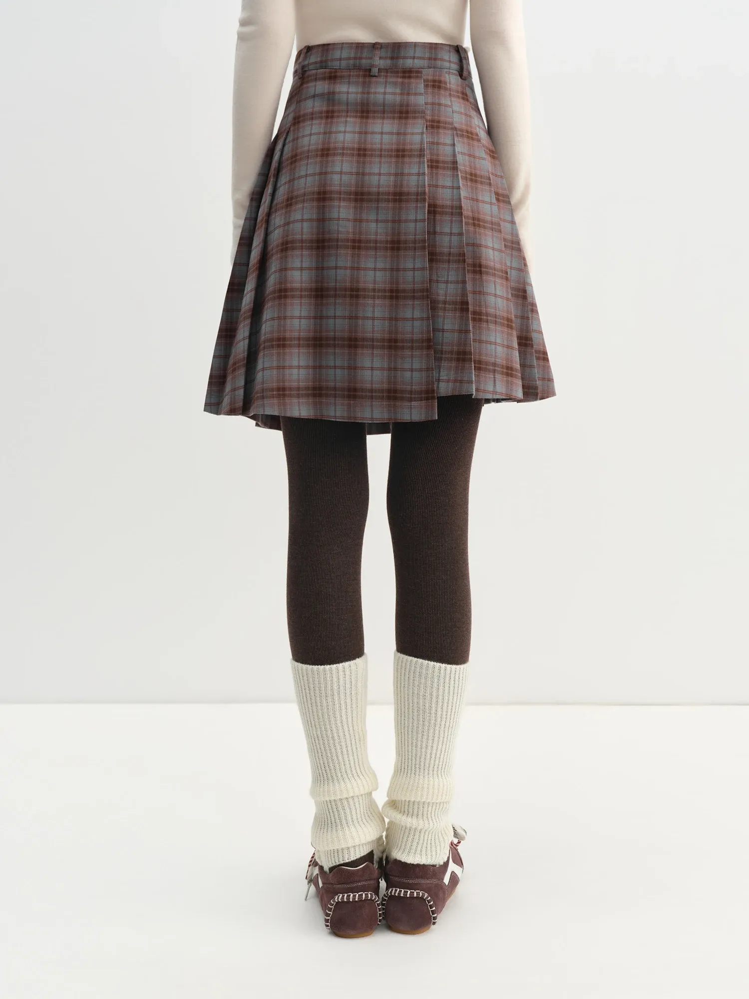 Mini jupe plissée à carreaux asymétrique hiver 2025